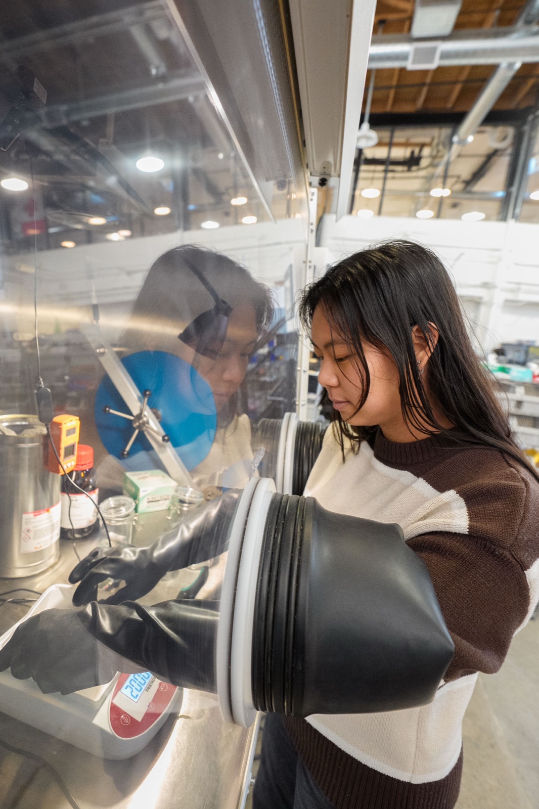 Marathon researcher working at the isotope glovebox
