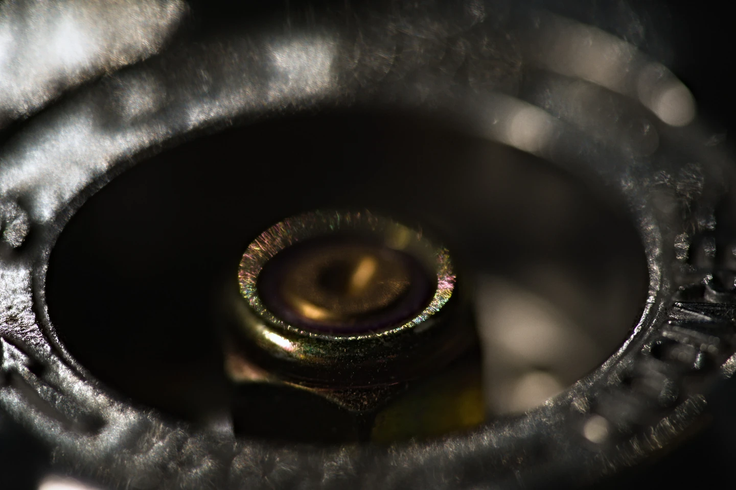 Close-up of a circular metal component inside Marathon’s laboratory equipment
